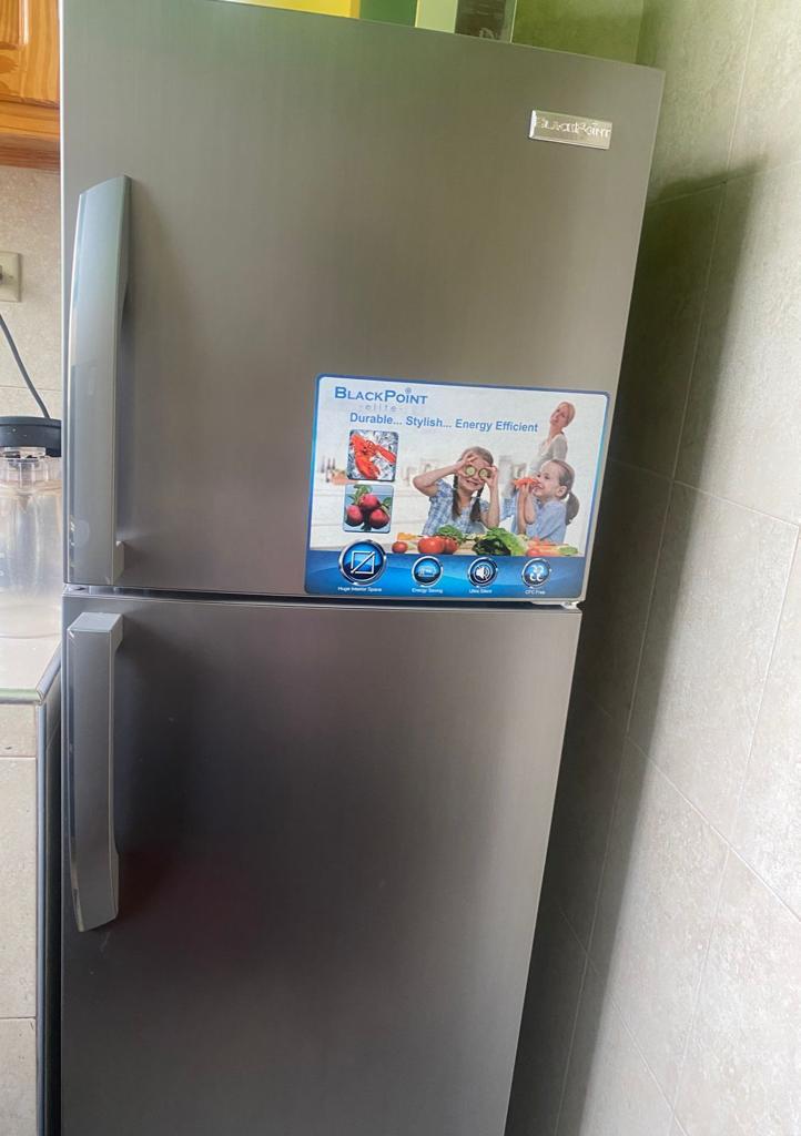 12 cub ft Silver Black Point Refrigerator for sale contact 8764614151